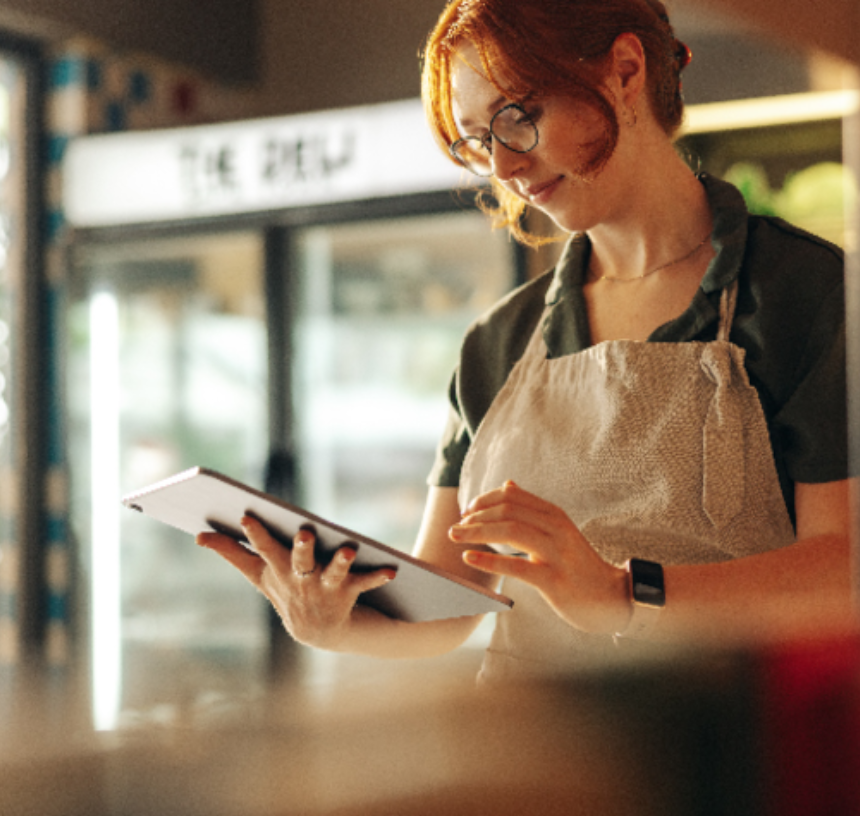 Modern bank branch interior with seating area and natural light