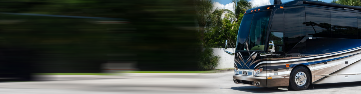 Motorcoach in motion driving down a street