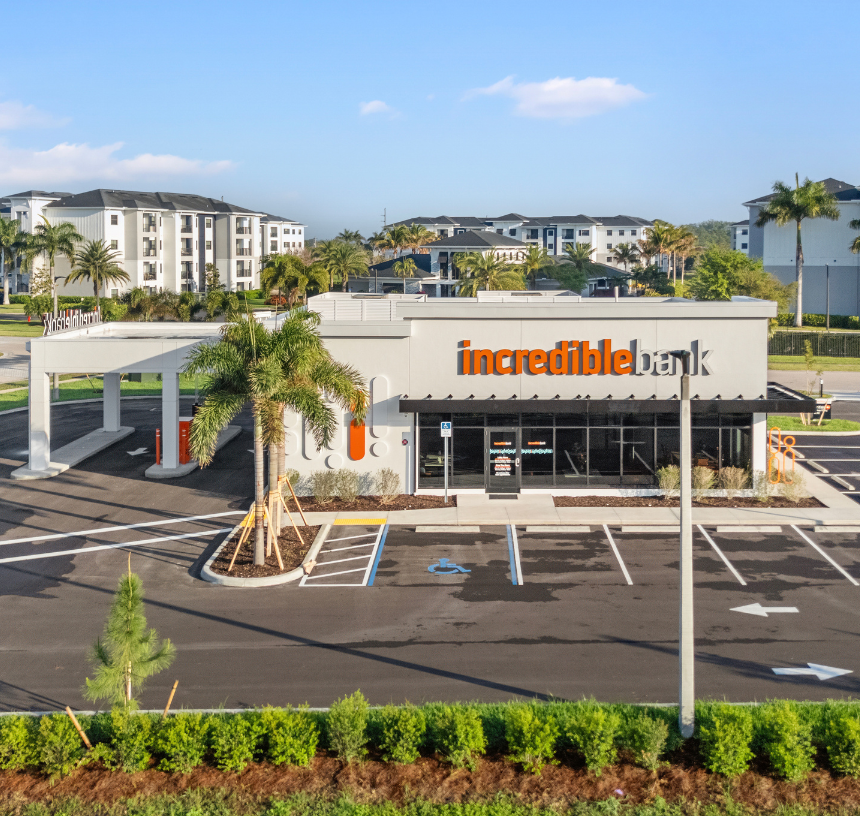 Modern bank branch interior with seating area and natural light