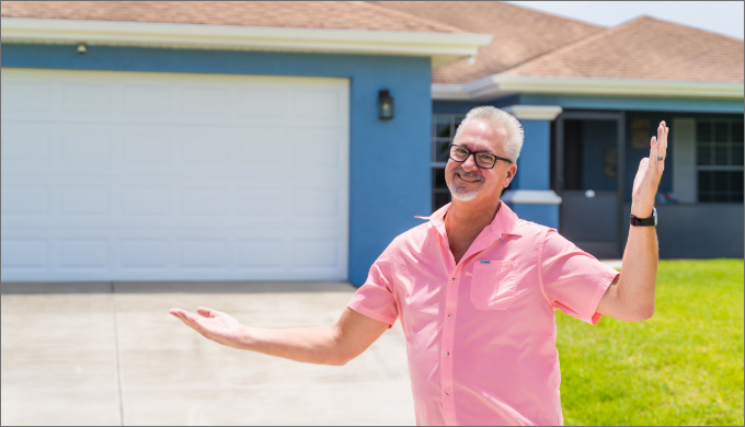 Don Hopkins, IncredibleBank mortgage customer, gesturing with his hands in front of his house