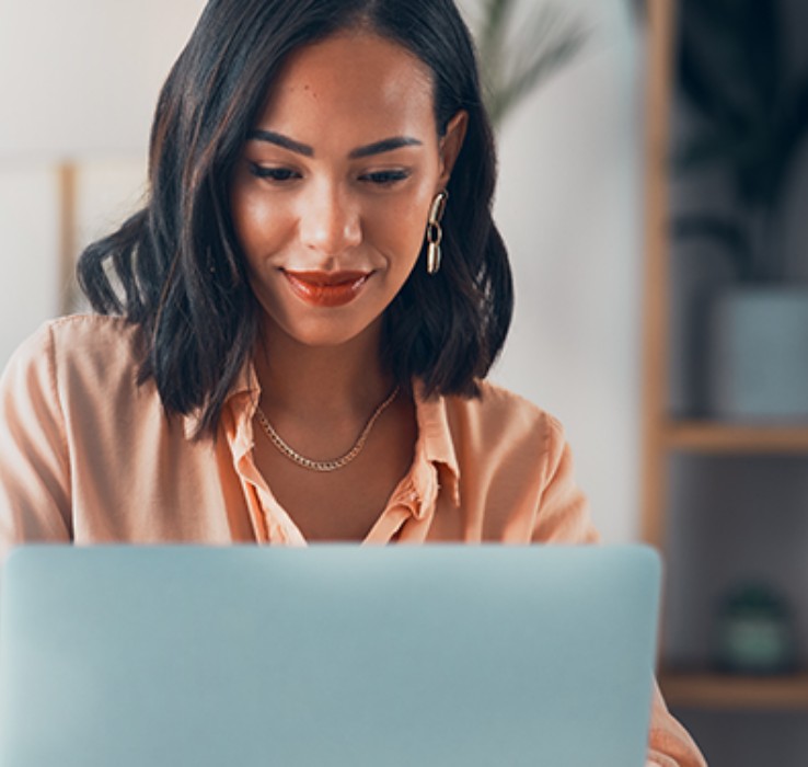 Woman looking at laptop screen