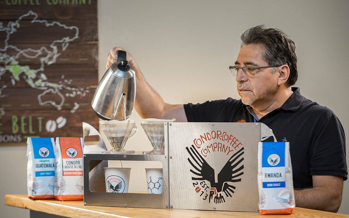 man working at a coffee shop