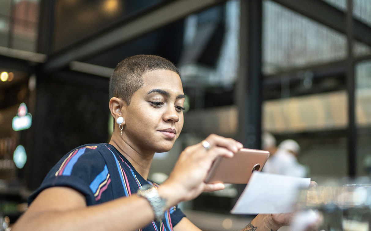 Business woman financing working capital on her smart phone
