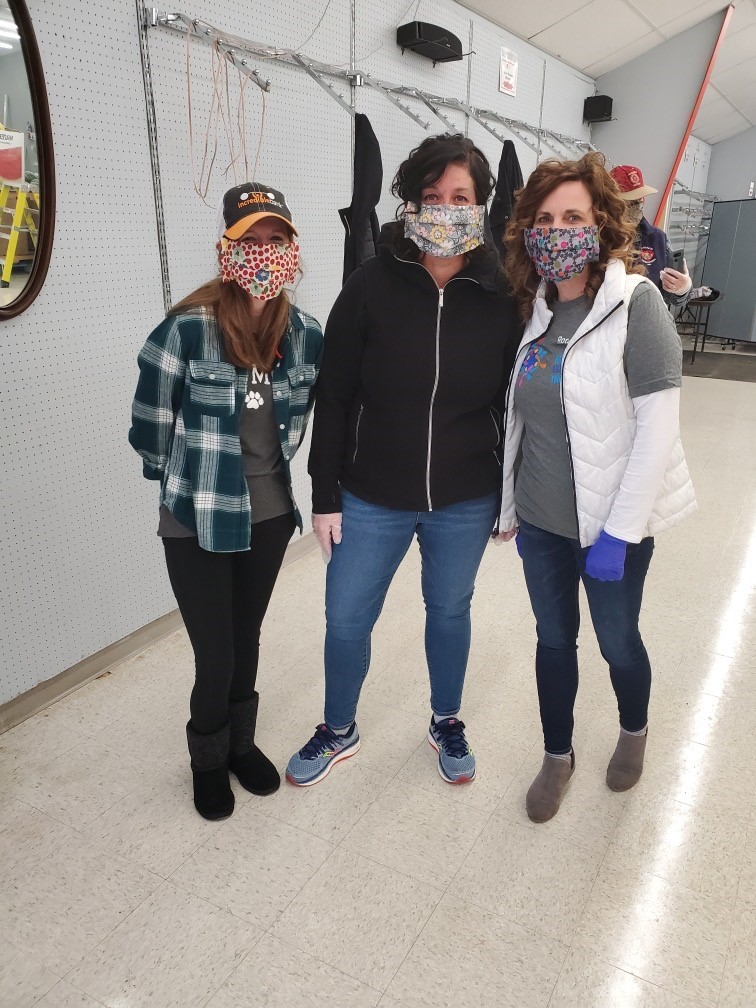 people wearing hand sewn face masks