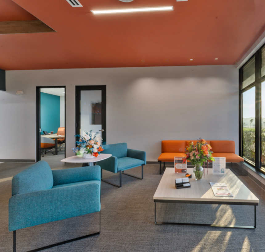 Modern bank branch interior with seating area and natural light