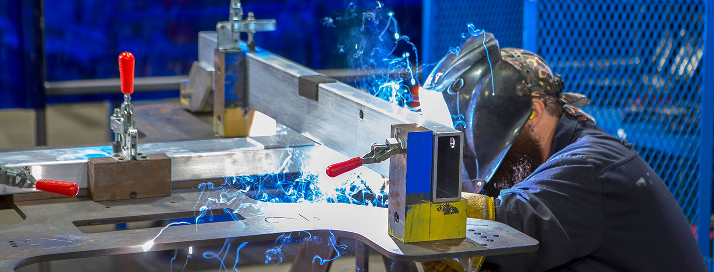 man welding at work